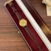 Classic Gold Round Dial Textured Brown Strap Watch for Women