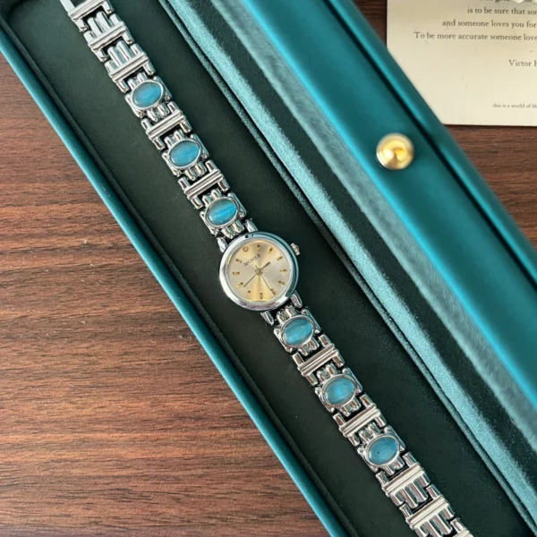 Elegant Blue Accent Round Dial Silver Bracelet Watch for Women