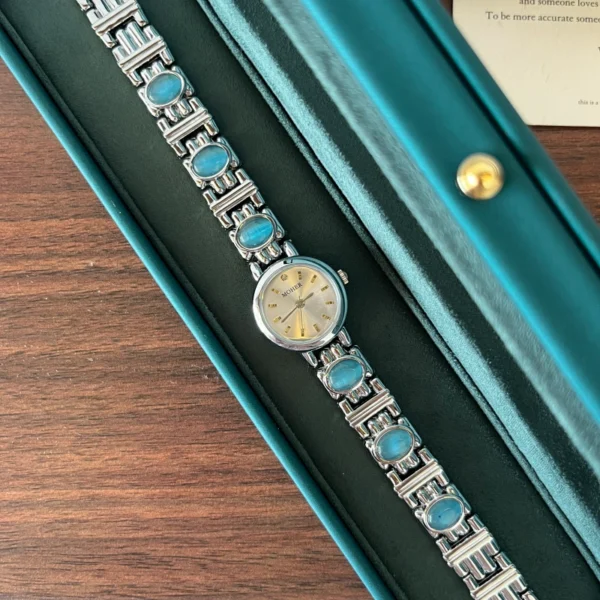 Elegant Blue Accent Round Dial Silver Bracelet Watch for Women