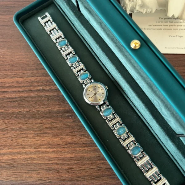 Elegant Blue Accent Round Dial Silver Bracelet Watch for Women