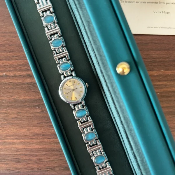 Elegant Blue Accent Round Dial Silver Bracelet Watch for Women