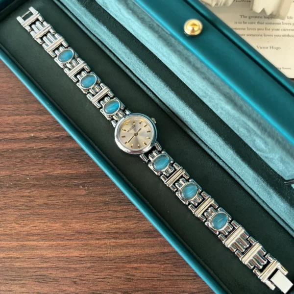 Elegant Blue Accent Round Dial Silver Bracelet Watch for Women