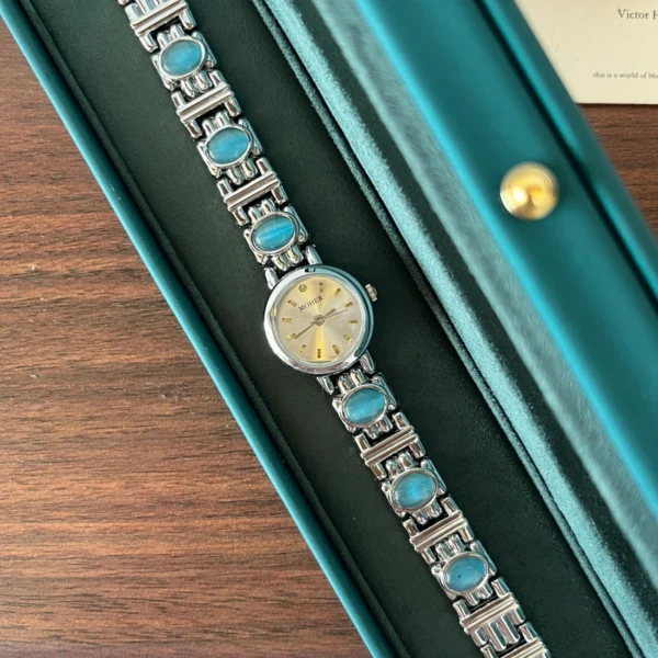 Elegant Blue Accent Round Dial Silver Bracelet Watch for Women