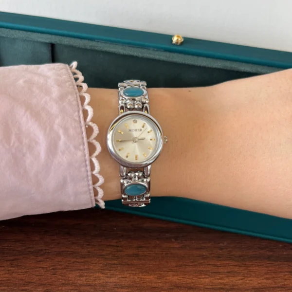 Elegant Blue Accent Round Dial Silver Bracelet Watch for Women
