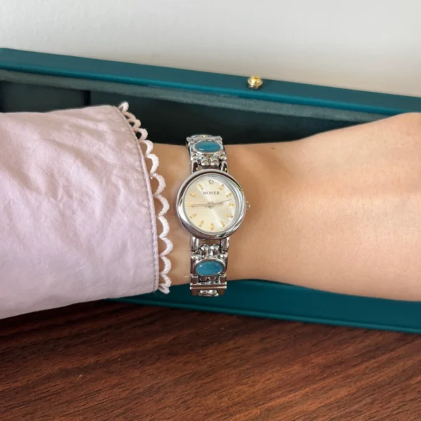 Elegant Blue Accent Round Dial Silver Bracelet Watch for Women