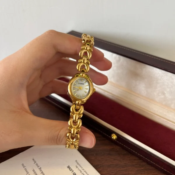 Classic Pale Oval Dial Gold Curved Link Bracelet Watch for Women