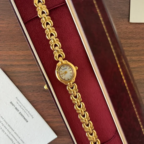 Classic Pale Oval Dial Gold Curved Link Bracelet Watch for Women