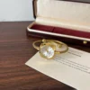 Elegant Pale Oval Dial Gold Open Cuff Watch for Women