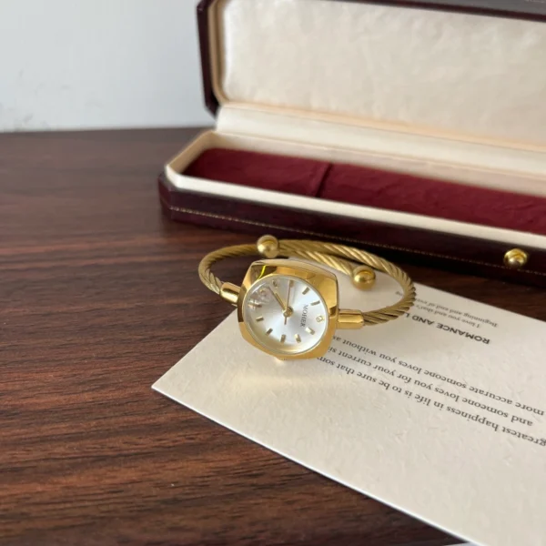 Elegant Pale Oval Dial Gold Open Cuff Watch for Women