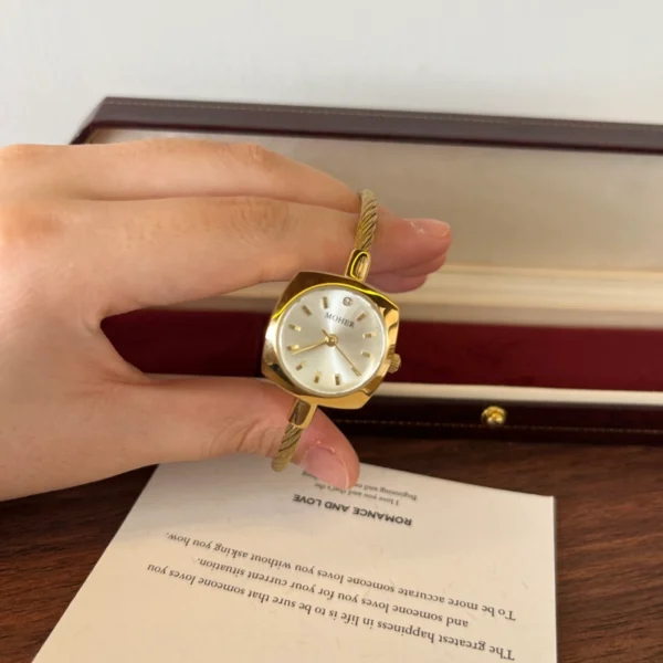 Elegant Pale Oval Dial Gold Open Cuff Watch for Women