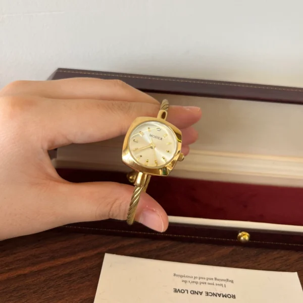 Elegant Pale Oval Dial Gold Open Cuff Watch for Women