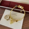 Elegant Gold Round Dial Floral Charm Bangle Watch for Women