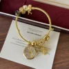 Elegant Gold Round Dial Floral Charm Bangle Watch for Women