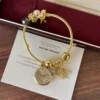 Elegant Gold Round Dial Floral Charm Bangle Watch for Women