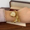 Elegant Gold Round Dial Floral Charm Bangle Watch for Women